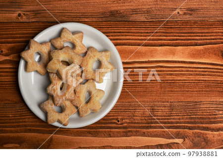 Homemade pastry concept. Tea cookies on wooden background Homemade pastry concept. Tea cookies on wooden background 97938881