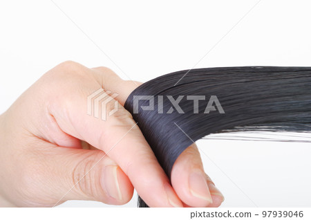 A woman touching her hair 97939046