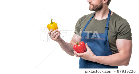 cropped view of man in apron with sweet pepper vegetable isolated on white 97939226