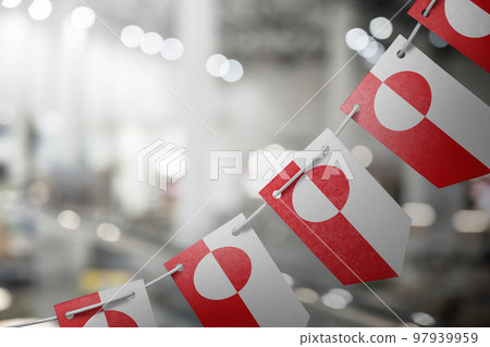 A garland of Greenland national flags on an abstract blurred background A garland of Greenland national flags on an abstract blurred background 97939959