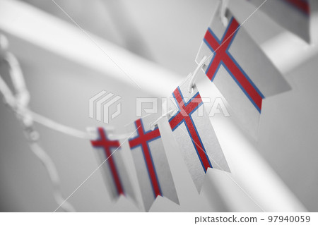 A garland of Faroe Islands national flags on an abstract blurred background A garland of Faroe Islands national flags on an abstract blurred background 97940059