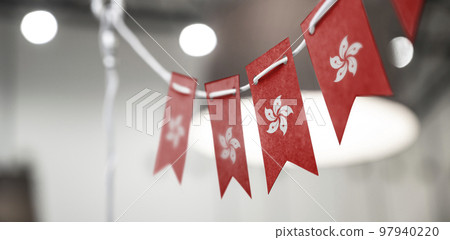 A garland of Hong Kong national flags on an abstract blurred background 97940220