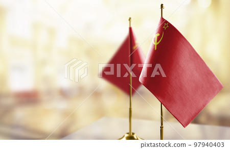 Small flags of the USSR on an abstract blurry background 97940403