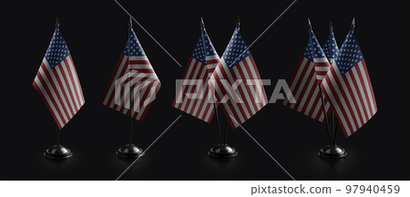 Small national flags of the USA on a black background Small national flags of the USA on a black background 97940459