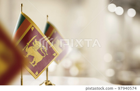 Small flags of the Sri Lanka on an abstract blurry background Small flags of the Sri Lanka on an abstract blurry background 97940574