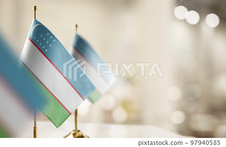 Small flags of the Uzbekistan on an abstract blurry background Small flags of the Uzbekistan on an abstract blurry background 97940585