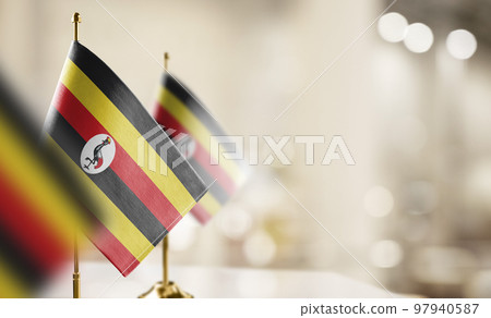 Small flags of the Uganda on an abstract blurry background Small flags of the Uganda on an abstract blurry background 97940587