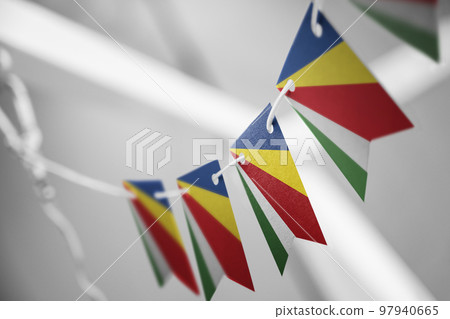 A garland of Seychelles national flags on an abstract blurred background A garland of Seychelles national flags on an abstract blurred background 97940665