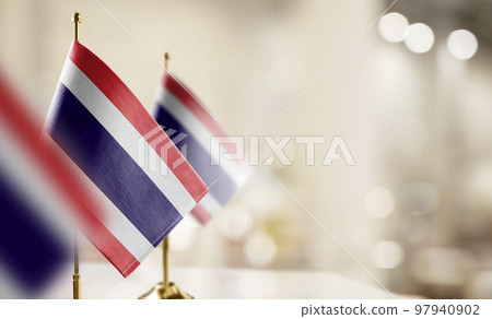 Small flags of the Thailand on an abstract blurry background 97940902