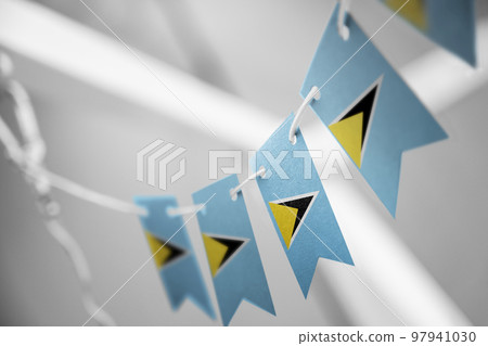 A garland of Saint Lucia national flags on an abstract blurred background A garland of Saint Lucia national flags on an abstract blurred background 97941030
