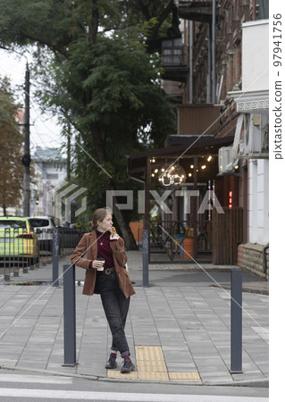 beautiful girl with baguettes and coffee beautiful girl with baguettes and coffee 97941756