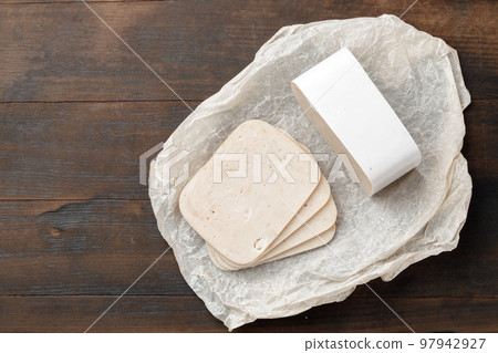 Cut chicken sausage slices on wooden table Cut chicken sausage slices on wooden table 97942927