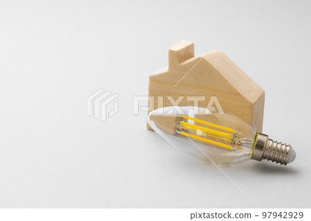 Light bulb on light grey paper background 97942929