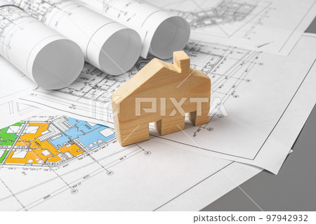 Architectural construction plans paper on table close up Architectural construction plans paper on table close up 97942932