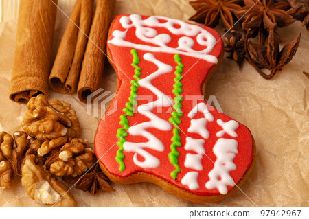 Gingerbread cookie on parchment paper close up 97942967