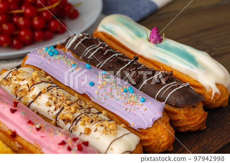 Eclair cake close up on wooden table 97942998