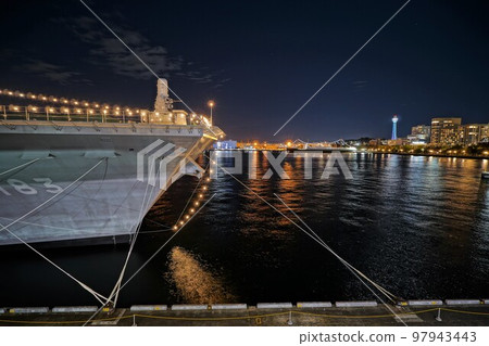 Battleship lit up at night 97943443