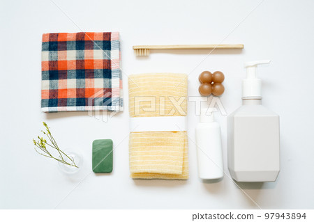 Bathroom spa products. shampoo, shower soap, towel, toothbrush on white background. flat lay, top view, copy space 97943894