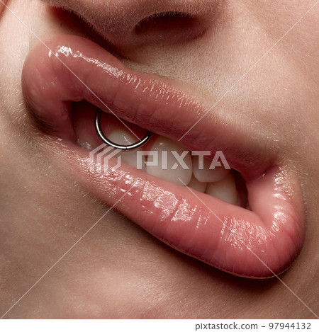 Making faces. Close-up expressive female mouth with white straigh teeth grimacing. Sensual woman's lips with nude color lipstick. Beauty, makeup, sensuality concept Making faces. Close-up expressive female mouth with white straigh teeth grimacing. Sensual woman's lips with nude color lipstick. Beauty, makeup, sensuality concept 97944132