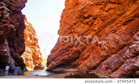 Simpsons Gap and back view of tourists 97945473