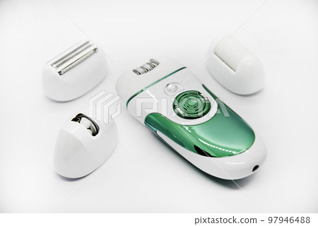 Women's electric razor for intimate places. A set of women's razor for hair on a white background. A white electric razor. 97946488