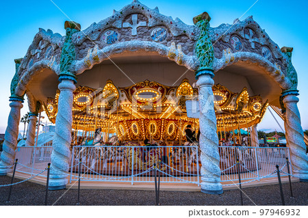 Spanish village in winter vacation _ merry-go-round at dusk 97946932