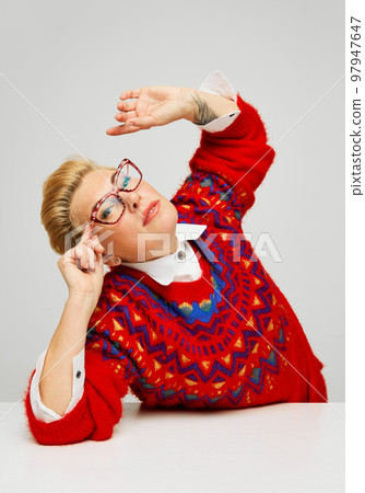 Extravagant, stylish and fashionable mature woman posing isolated over grey studio background. Fashion, style, beauty and emotions concept 97947647