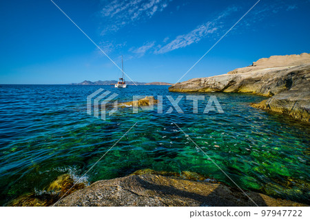Yacht boat at Sarakiniko Beach in Aegean sea, Milos island , Greece 97947722