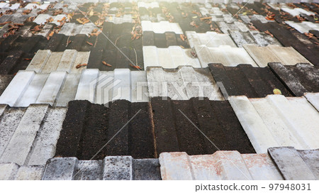 Texture of dark colour traditional double carved roof tiles Texture of dark colour traditional double carved roof tiles 97948031