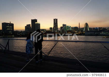 Late evening in Minato Mirai, Yokohama. Guy and girl on the roof International Passenger Terminal 97948611