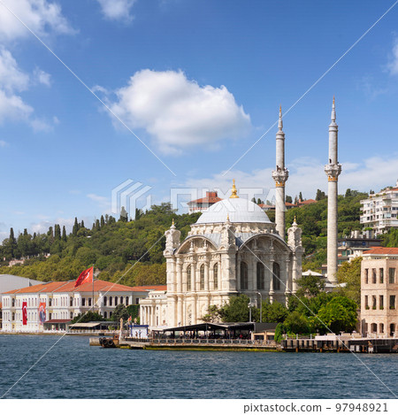 View from Bosphorus Strait overlooking Ortakoy Mosque, or Ortakoy Camii, suited at Ortakoy pier square, Istanbul, Turkey 97948921