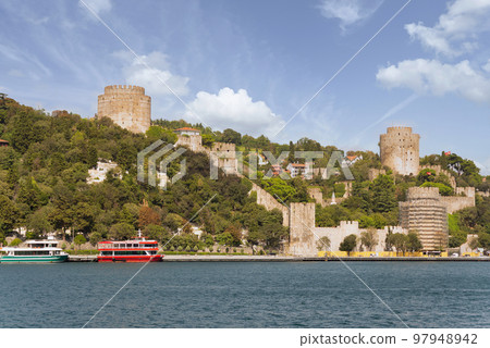 Rumelihisari, or Bogazkesen Castle, at the hills of the European side of Bosphorus Strait, Istanbul, Turkey 97948942