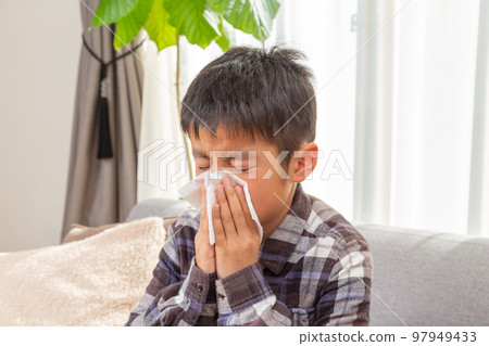 Boys chewing his nose 97949433