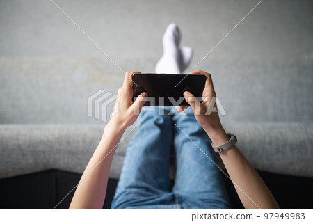 Hands holding the phone Hands holding the phone 97949983
