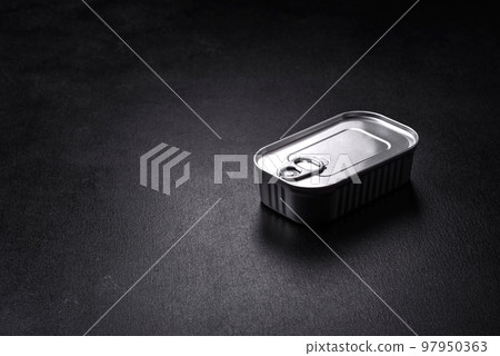 Tin or aluminum rectangular can of canned food with a key 97950363