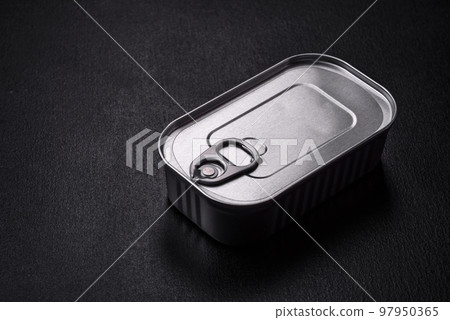 Tin or aluminum rectangular can of canned food with a key 97950365