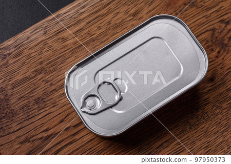 Tin or aluminum rectangular can of canned food with a key 97950373