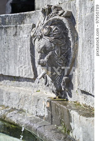 Faun head sculptue as part of medieval fountain at Plaza del Espiritu Santo in Vegueta, Las Palmas de Gran Canaria, Spain Faun head sculptue as part of medieval fountain at Plaza del Espiritu Santo in Vegueta, Las Palmas de Gran Canaria, Spain 97950789