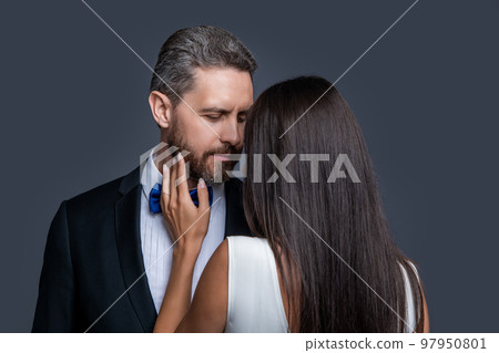 love couple in formal tuxedo. studio shot of formal tuxedo couple in love. elegant love couple love couple in formal tuxedo. studio shot of formal tuxedo couple in love. elegant love couple 97950801