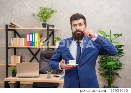 confused brutal ceo in businesslike suit has lunch break with coffee cup at the office, lunch break 97951030