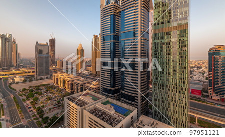 Aerial view of Dubai International Financial District with many skyscrapers timelapse. 97951121
