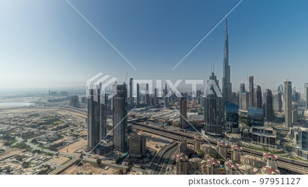Panorama showing aerial view of tallest towers in Dubai Downtown skyline and highway timelapse. Panorama showing aerial view of tallest towers in Dubai Downtown skyline and highway timelapse. 97951127