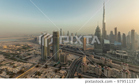 Panorama showing aerial view of tallest towers in Dubai Downtown skyline and highway timelapse. Panorama showing aerial view of tallest towers in Dubai Downtown skyline and highway timelapse. 97951137
