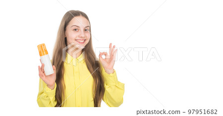 happy kid presenting shampoo conditioner bottle show ok gesture isolated on white copy space, ad. 97951682