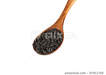 Wooden spoon with black salt isolated on white background. Wooden spoon with black salt isolated on white background. 97951708