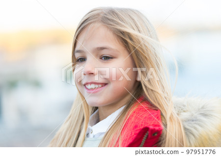 Girl with blond long hair on autumn day outdoor 97951776