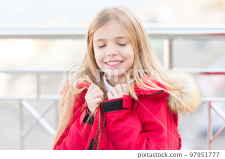 Kid with closed eyes smile on blurred environment 97951777