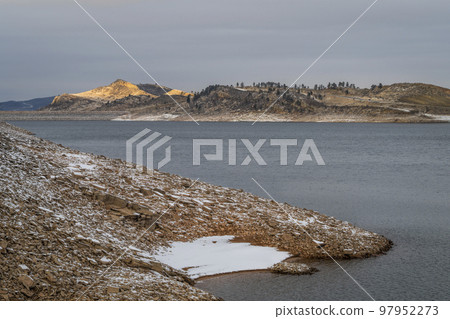 calm winter dusk over mountain lake 97952273