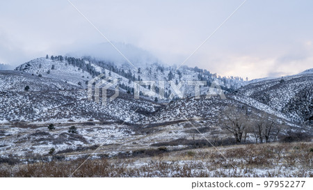 winter dusk over foothills of Rocky Mountains 97952277
