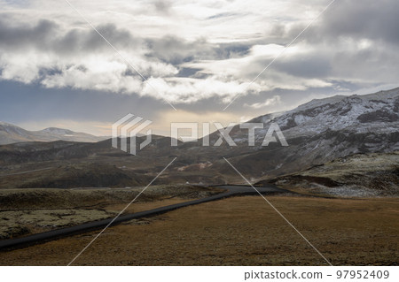 Road in a valley and mountains, Iceland Road in a valley and mountains, Iceland 97952409